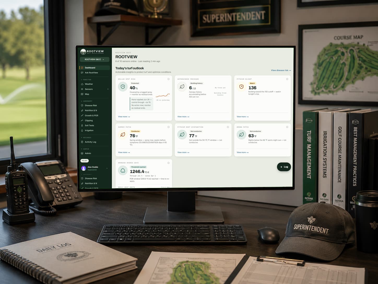 Superintendent in the office reviewing the RootView dashboard with dollar spot, anthracnose, and other disease monitoring panels
